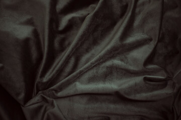 black textile background, sepia velvet with folds background image, dark fabric silk for background...