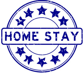 Grunge blue home stay word with star icon round rubber seal stamp on white background