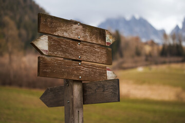 Sign for hiking trails in the Dolomites. Signpost on a hiking trail in the Alps.