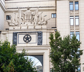 Facade of the building with soviet era emblems. History