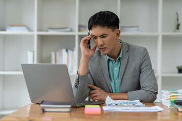 Fototapeta premium tired business man sleepy and bored from sitting at a desk for a long time and has office syndrome