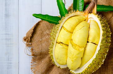 top view of Durian fruit. Ripe monthong durian on white wood background, king of fruit from Thailand