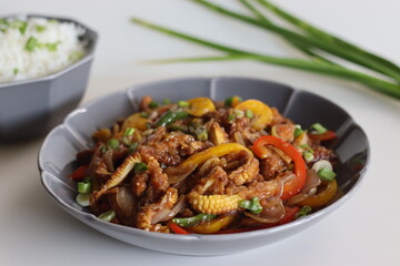 Baby corn chilly served along with butter rice with spring onions