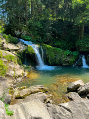 Fototapeta premium Perfect landscape with waterfall in the Carpathian Mountains. West part on Ukraine, small waterfall in the wild river.