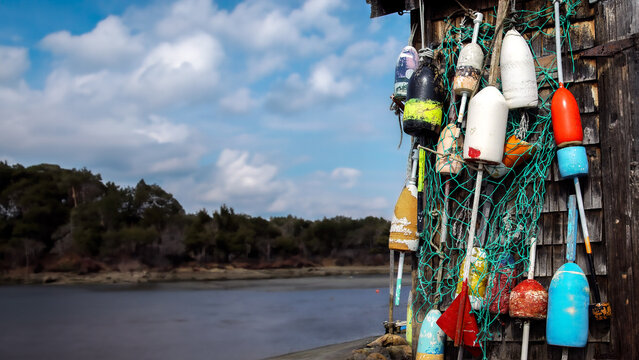 Lobster fishing shack on the coast. With colorful buoys.