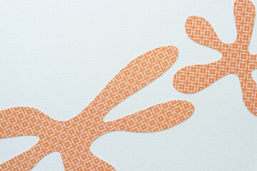 cut paper shapes with protrusions or arms resembling starfish or daisies