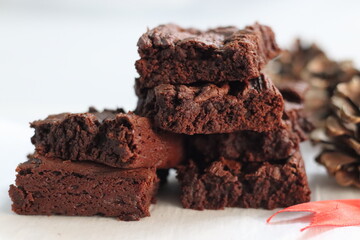 Sliced chocolate brownie, egg less preparation. Home baked fudgy chocolate brownie sliced in square...