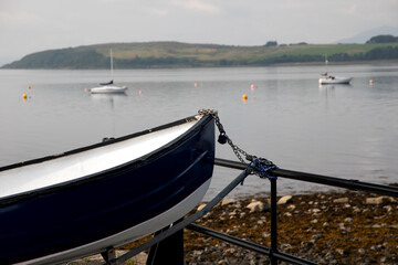 Old Rowing Boat Bow Section Closeup View with Out of Focus Marine Background
