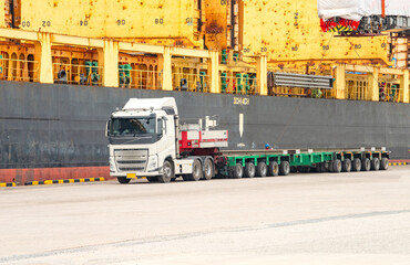 Transport of Oversize Heavy cargo trailera a multi-axle hydraulic modular truck trailer Loading a port area