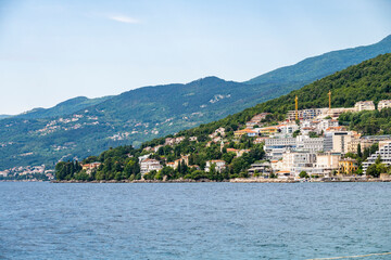 Fototapeta premium Steep, forest covered slopes of istrian peninsula at the town of Opatija, popular tourist destination in north Adriatic, Croatia