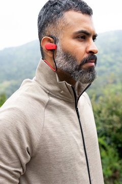 Man with sportswear and earphones outdoors