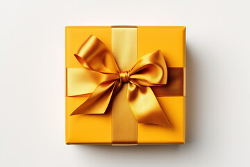 Obraz na płótnie Canvas Yellow gift box with golden bow