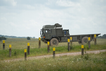 British army MAN SV 4x4 flat-bed logistics lorry in action