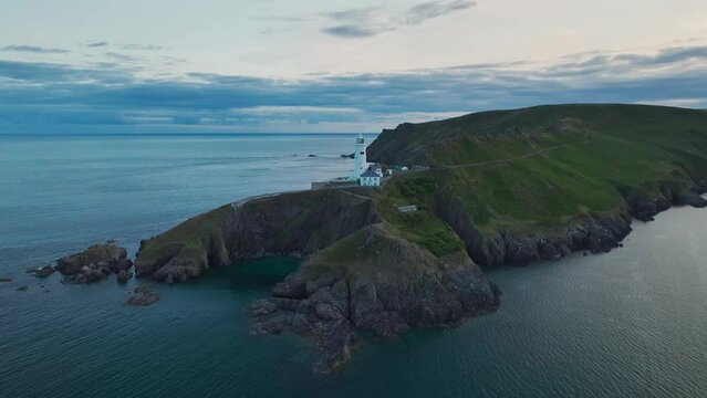 Sunset over Start Point Lighthouse from a drone, Trinity House and South West Coast Path, Devon, England