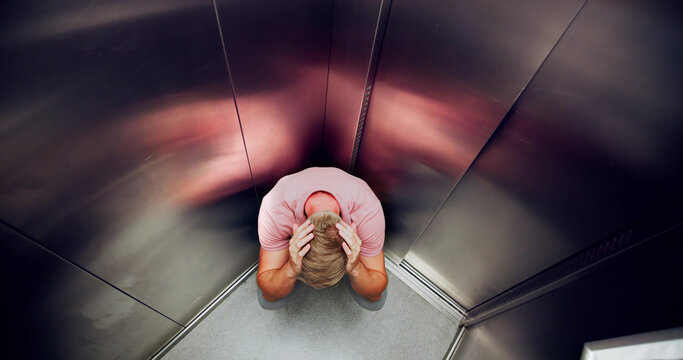 Man Suffering From Claustrophobia Trapped Inside Elevator