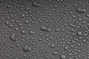 a real photo of water droplets on a black background