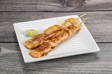 Grilled salmon skewer with sauce