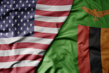 Obraz premium big waving colorful flag of united states of america and national flag of zambia .