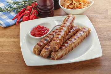 Grilled sausages with cabbage and sauce