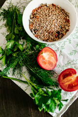 bulgur grits with spices, herbs and fresh vegetables for cooking. vegan food