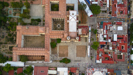 Aerial views of the Ex-convent of Santo Domingo in the City of Oaxaca, Mexico, the roofs are reddish and there is an ethnobotanical garden