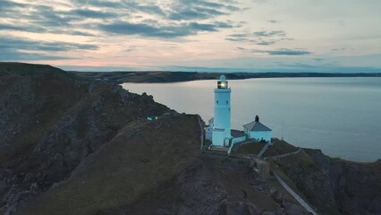 Sunset over Start Point Lighthouse from a drone, Trinity House and South West Coast Path, Devon, England