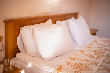 pillows on the bed in the hotel room, cozy atmosphere rest