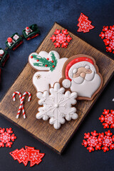 Fototapeta premium Beautiful festive Christmas gingerbread made by hand with decoration elements