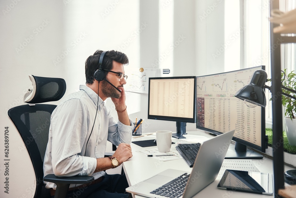 Poster always available. side view of young bearded trader in headset talking with client and looking at mo