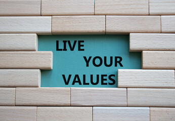 Live your values symbol. Concept words 'Live your values' on wooden blocks. Beautiful grey green background. Business and Live your values concept. Copy space.