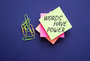 Words have power symbol. Yellow steaky note with paper clips with words Words have power. Beautiful...