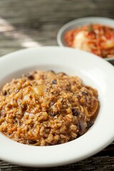 Savory Fusion: Close-Up of Kimchi Fried Rice, a Delectable Blend of Flavors, Captured in 4K Resolution