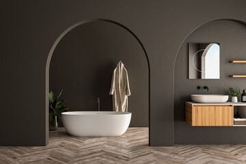 Modern bathroom interior with wooden vanity, bathtub, parquet floor, black walls, arches, plants