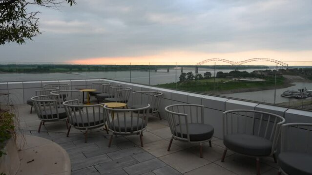 Memphis rooftop bar at sunset with bridge in the background