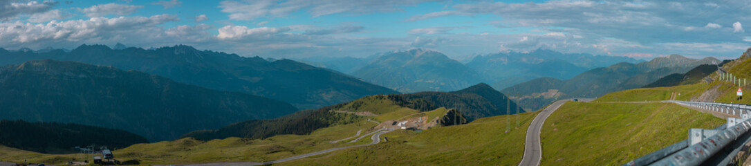 Fototapeta na wymiar Wide panorama of jaufenpass or passo giovo in italian dolomites on a sunny day.