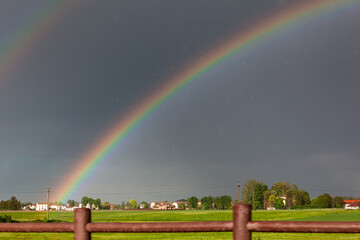 Double rainbow on a beautiful hills scenery in Italy