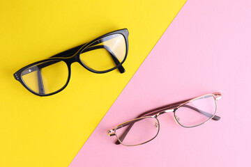 glasses for vision correction on a colored background with space for text