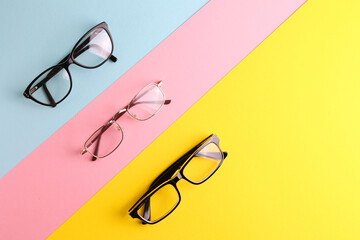 glasses for vision correction on a colored background with space for text
