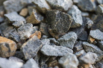 Rubble as background, natural stone, selective focus, graphic resource