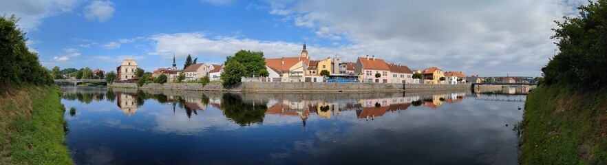 Fototapeta na wymiar Susice city center panorama view of town hall and historical houses from Otava river side, Sumava region,Czech republic panorama landscape view