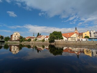 Fototapeta na wymiar Susice city center panorama view of town hall and historical houses from Otava river side, Sumava region,Czech republic panorama landscape view