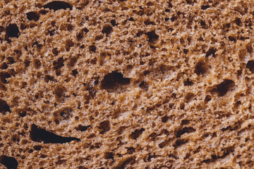 Brown bread texture, closeup background. Macro shot