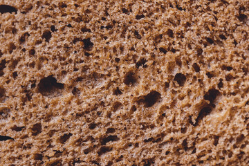 Brown bread texture, closeup background. Macro shot