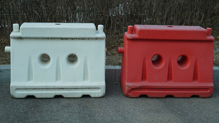 red and white road blocks