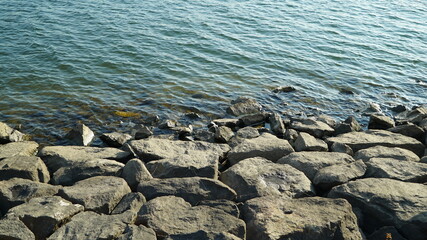Stones piled on the river bank