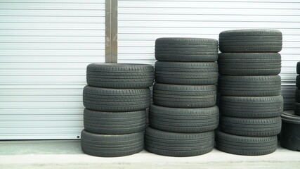 Tires stacked in front of the car center shutter door