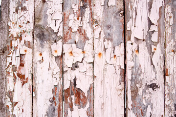 Old boards and cracked paint. The beauty of old things. Pink background from old boards. Handmade. Creative background.