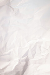 White crumpled paper texture background.