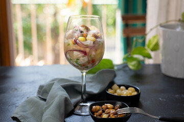 Typical Peruvian dish called Ceviche, served in a crystal glass.