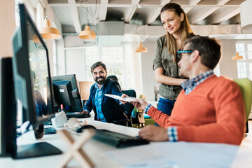 Young people working in a startup company office